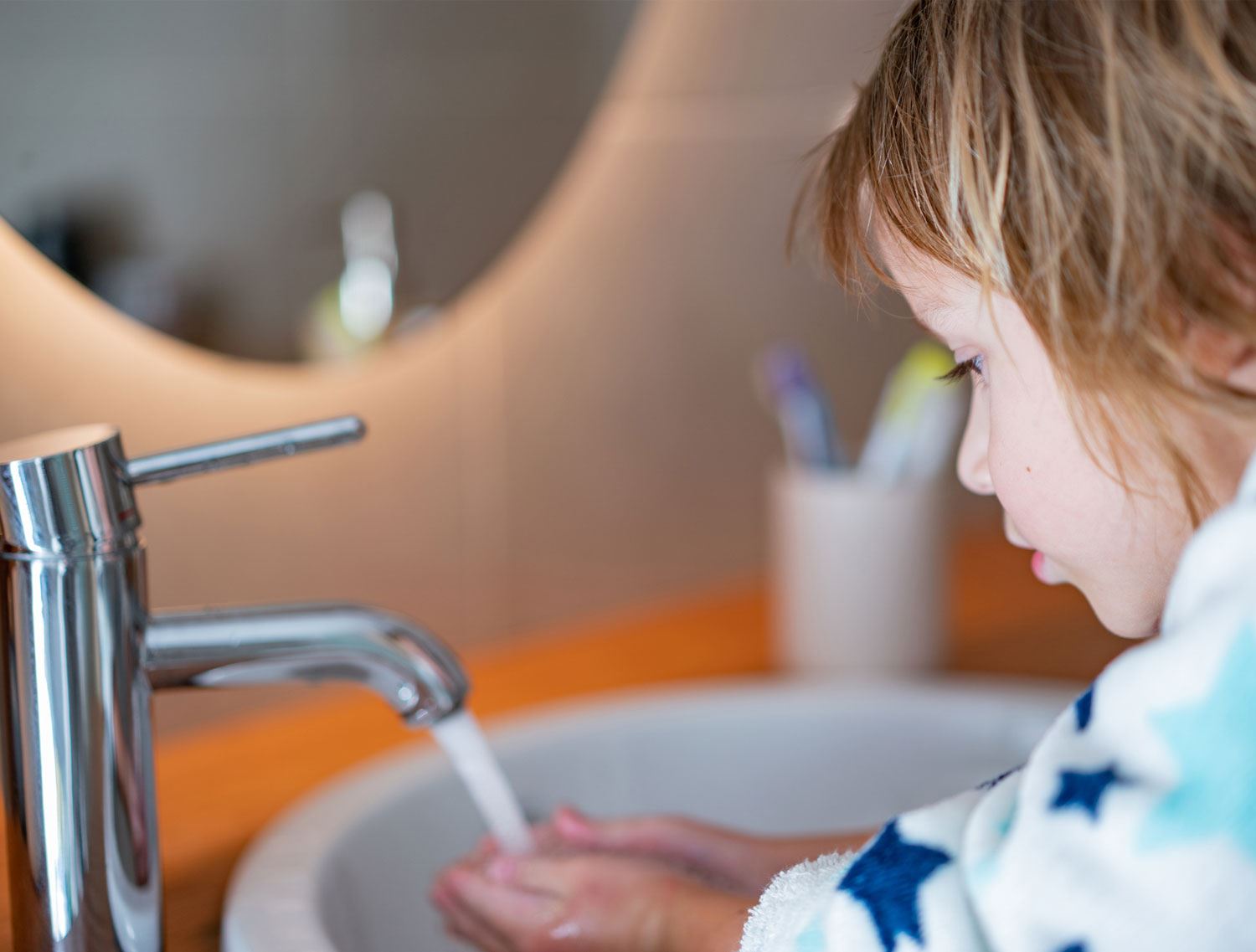 Boy washing hands