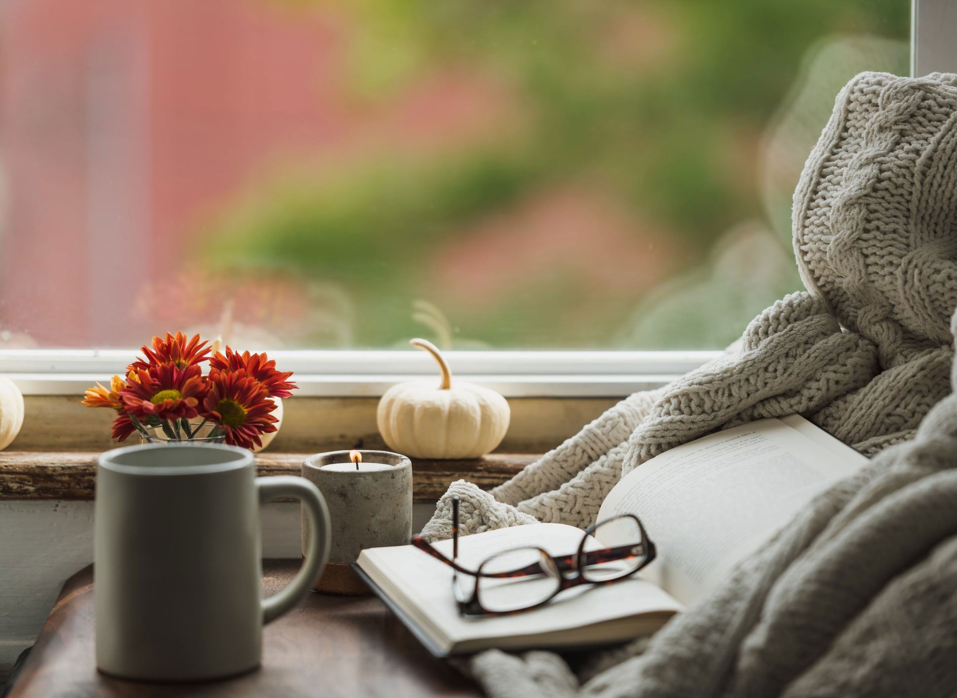 Glasses, book, mug & flowers